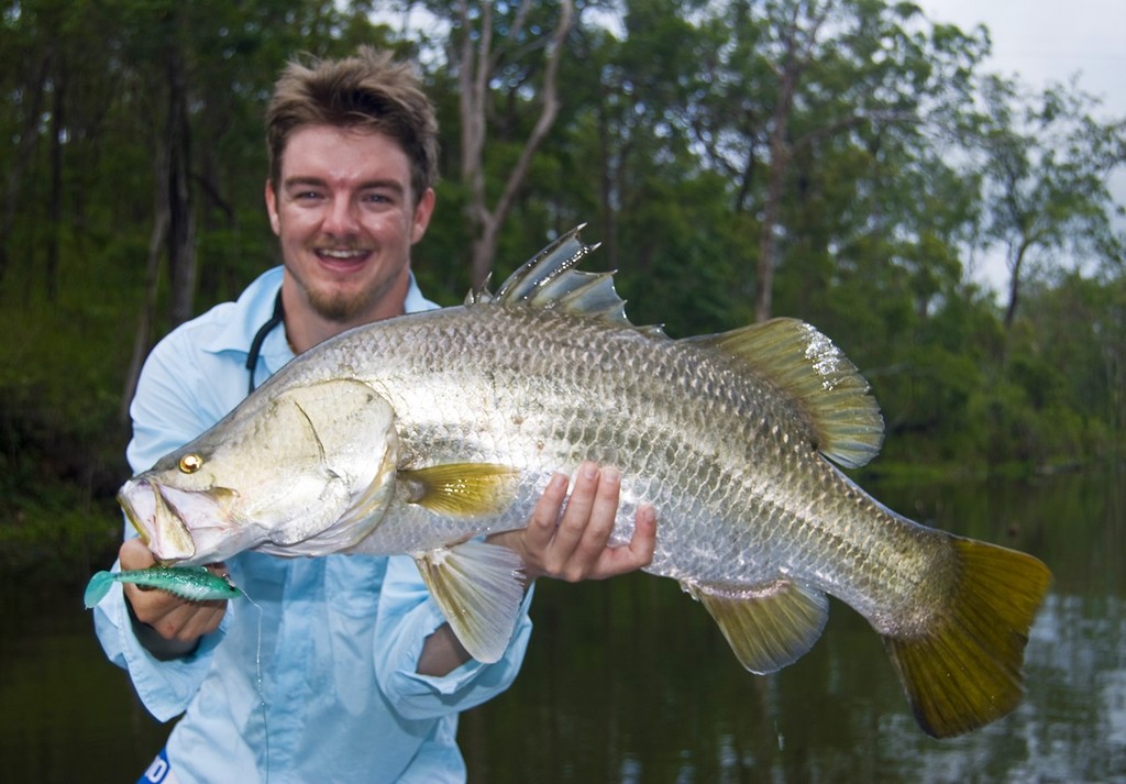 Lures that vibrate and pulse in the water, like the paddle tail of a Squidgy Slick Rig, are a good wet weather choice.  Predatory fish zero in on the tail beat in the dirty water. - Wet Season Awakening © Lee Brake